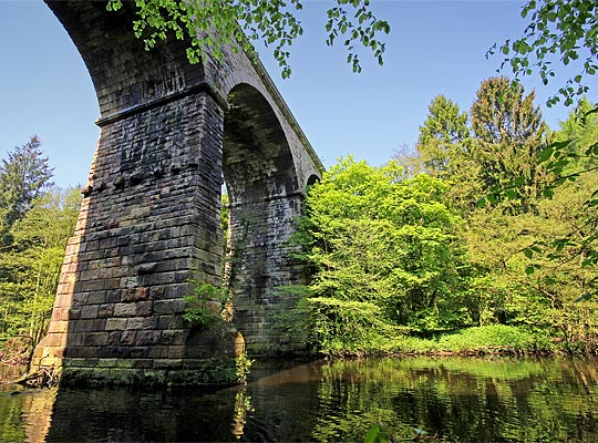 This impressive structure comprises seven stone arches, although most are sadly masked by trees.