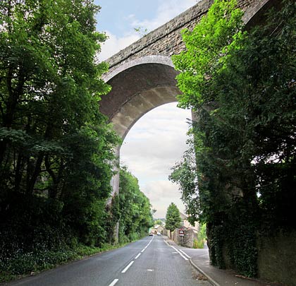 The original viaduct - now masked by trees - was mostly stone-built.