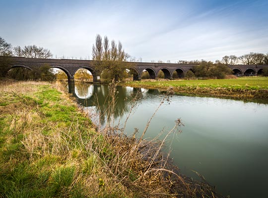 Thrapston Viaduct spans the River Nene, an island formed by a parallel loop and the flood plain associated with both.