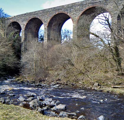 Glenmuir Water runs alongside the viaduct before passing beneath it.