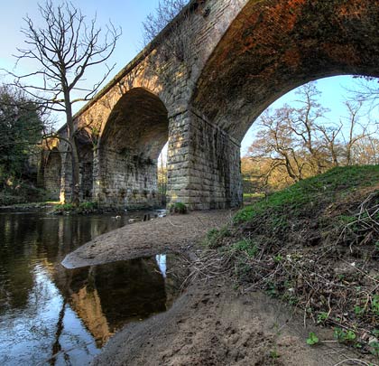 Curved in plan, the structure - which is now Grade II listed - comprises four segmental arches spanning the River Derwent.