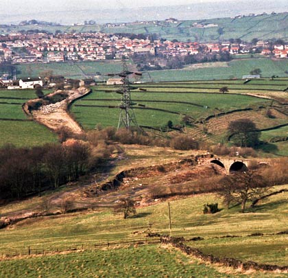 A high-angle view of Queensbury's triangular station, captured with its now-disappeared viaduct in the eighties.