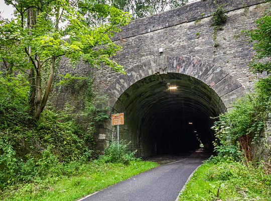 The tunnel's imposing east portal is entirely stone-built and features a substantial headwall measuring almost 130 feet across.