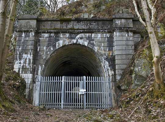 The east portal is an imposing structure, built in concrete but cast to appear like masonry.