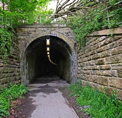 The eastern portal is modest but is flanked by long wing walls.
