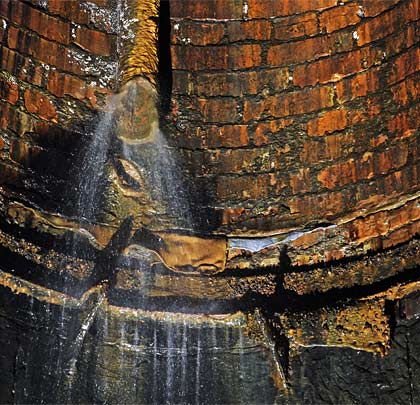 A broken downpipe discharges water into the tunnel from No.4 shaft.