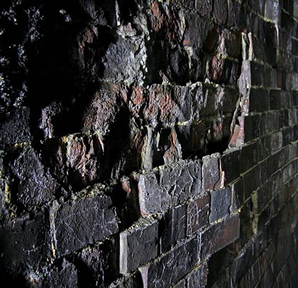 In places, some of the brick faces are peeling away.