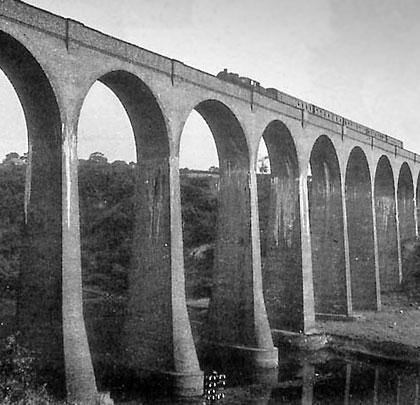 In operational times, a train heads north over the sky-high arches.