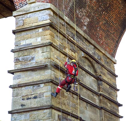 The river pier is inspected by an abseiling engineer during preliminary works for the Waverley Railway reinstatement project.