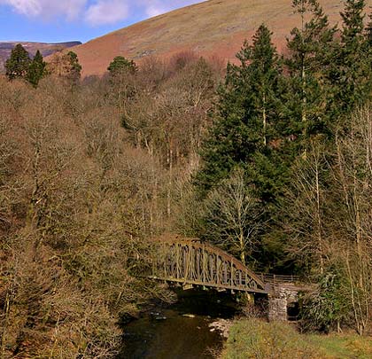 The most easterly of the eight bowstring bridges, overshadowed by Blease Fell, takes the trackbed out of the Greta gorge.