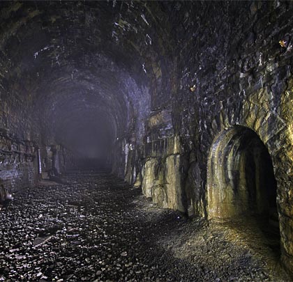 Calcite paints a deep refuge in the Old tunnel as mist tries to dim the light entering at the tunnel's west end.