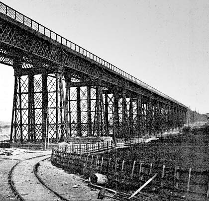 Still under construction, the viaduct is captured late in 1877 with the contractor's temporary railway running alongside it.