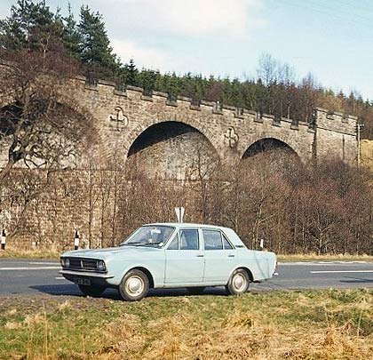 A sunlit Kielder viaduct provides an attractive backdrop to a shot of the photographer's Ford Cortina.