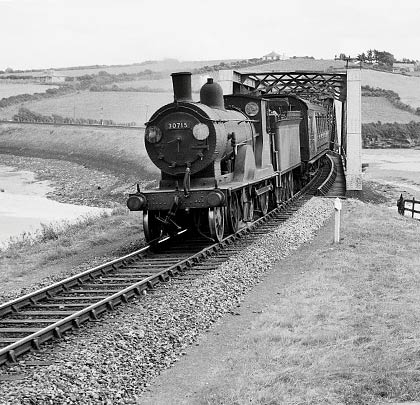 30715 escorts a Down train over the bridge in 1958.