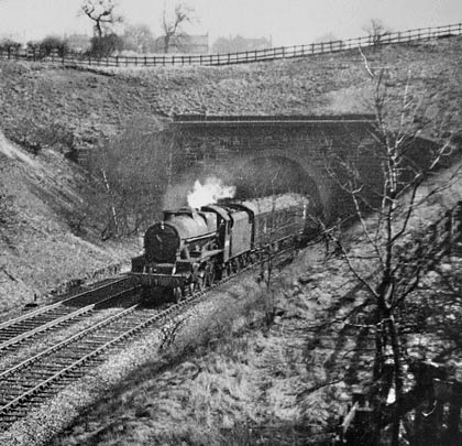 In February 1963, Jubilee class 45698 Mars leaves the west end of the tunnel, heading towards Cleckheaton.