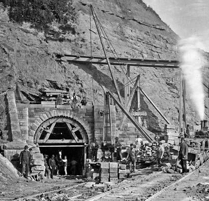 An outstanding historical photograph capturing the industry at the south portal during construction.