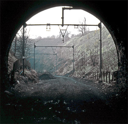 By January 1983, the tracks between the two tunnels had been lifted but the overhead line structures remained.