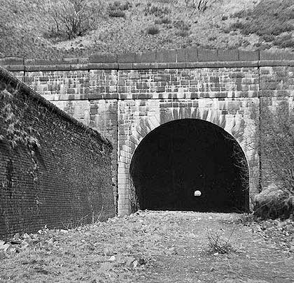A view through the tunnel from the west end shortly after track lifting in 1963 but prior to the burial of the eastern entrance.