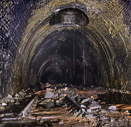 Beneath No.4 shaft, a solitary track panel somehow evaded the salvage men's attention to hint at the tunnel's former role.