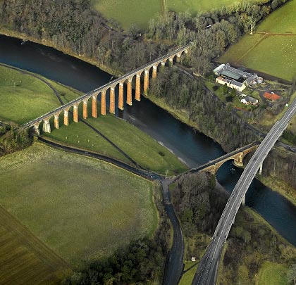 An aerial view from the south-east, showing the proximity of the three structures that cross the river at Leaderfoot.