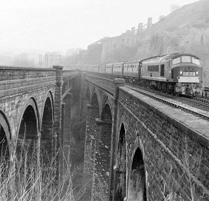 A Nottingham-Manchester express approaches Millers Dale on the Down Fast.
