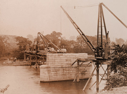 A scene of industry on the Clyde as the two mid-river piers are constructed.