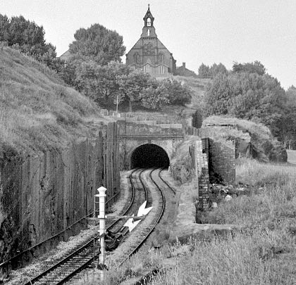 An intriguing picture showing the vertical face of the western approach cutting and church perched above the tunnel's alignment.