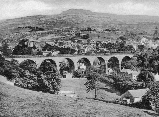 An archive view of the structure, providing foreground interest to the village and hills.
