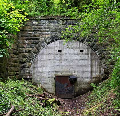 The west portal is less afflicted by landfill and benefits from wing walls running parallel with the former trackbed.