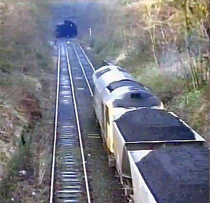 Following the closure of Silverdale Colliery in December 1998, the last train-load of coal is hauled away towards the tunnel's east portal.