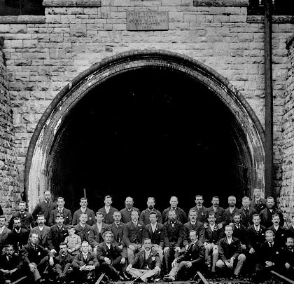 Key staff pose at the south portal to mark the tunnel's opening in 1879.