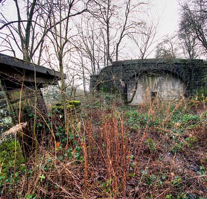 The cosmetic nature of the tunnel is confirmed by the absence of hillside above and to the left of the south portal.