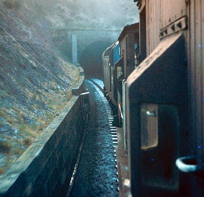 The view from a southbound brake van at Whitrope's darkness looms in December 1968.