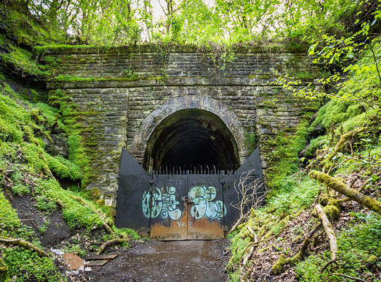 The north-east portal is an imposing stone-built structure, pushed into the end of a steeply-sided approach cutting.