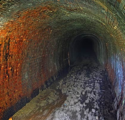 The east end of the tunnel features thick, deep mud and incorporates a slight curve to the south.