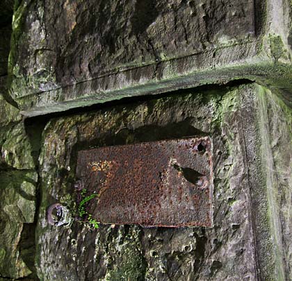 Appended to the left hand side is a metal plate bearing the tunnel's faded structure number of 71A.