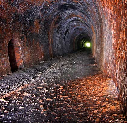 Built for a single line, the brick-lined tunnel is straight except for a slight curve at its southern end.