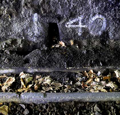 A concrete cable trough sits at the foot of the south-side wall.