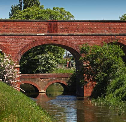 The flatter arch across Folly Drain, with a diminutive road crossing immediately beyond it.