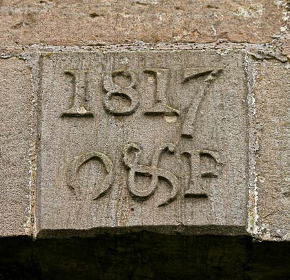 An 1817 datestone is inserted in the west elevation.