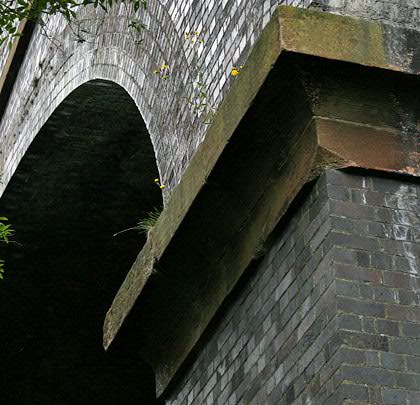 The arches are perched on masonry-topped piers.