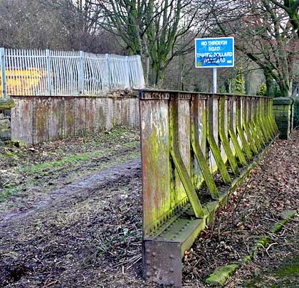 The railway has been landfilled either side of Clay House Lane, but the underbridge that accommodated it still survives.