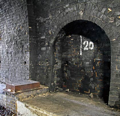The tunnel, which accommodates a water main along the foot of its south wall, features three changes of profile.