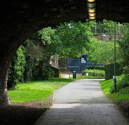 Looking back towards the daylight, a distant glimpse can be caught of Scotland Street Tunnel's north portal.