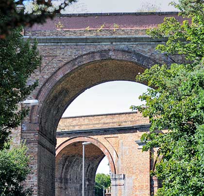 Sunlit through the arch is Branksome's operational West viaduct.