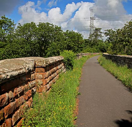Walkers can now cross the deck on a footpath, protected by the viaduct's substantial stone parapets.