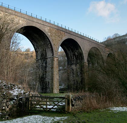 The viaduct sits in a deep, steep-sided valley.