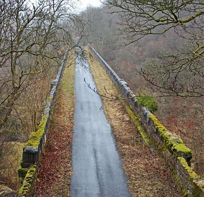 Built with the intention of carrying two lines, the moss-coated viaduct now plays host to a single cycle track.