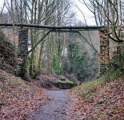 A pipeline crosses the trackbed which here is a footpath.