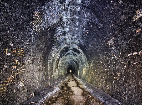 Towards the south end, the tunnel lining is extensively soot-covered.